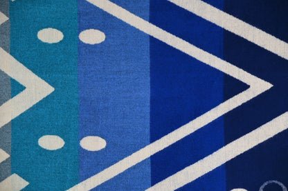 Blue and turquoise geometric pattern and woven texture of the Aztec Blue alpaca blanket