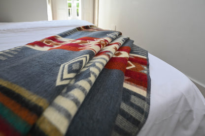 Folded Andean Horizon alpaca blanket showing its geometric pattern