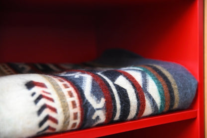 Close-up of the rolled Andean Horizon Aztec alpaca blanket